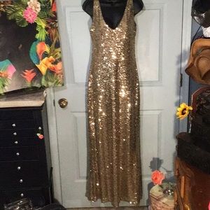 Floor length gold sequined dress